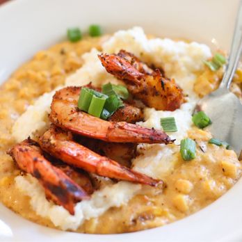 Cafe Amelie signature dishes Gulf Shrimp and GritsGumboBread Pudding
